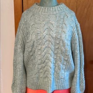 Pale blue and white acrylic sweater medium